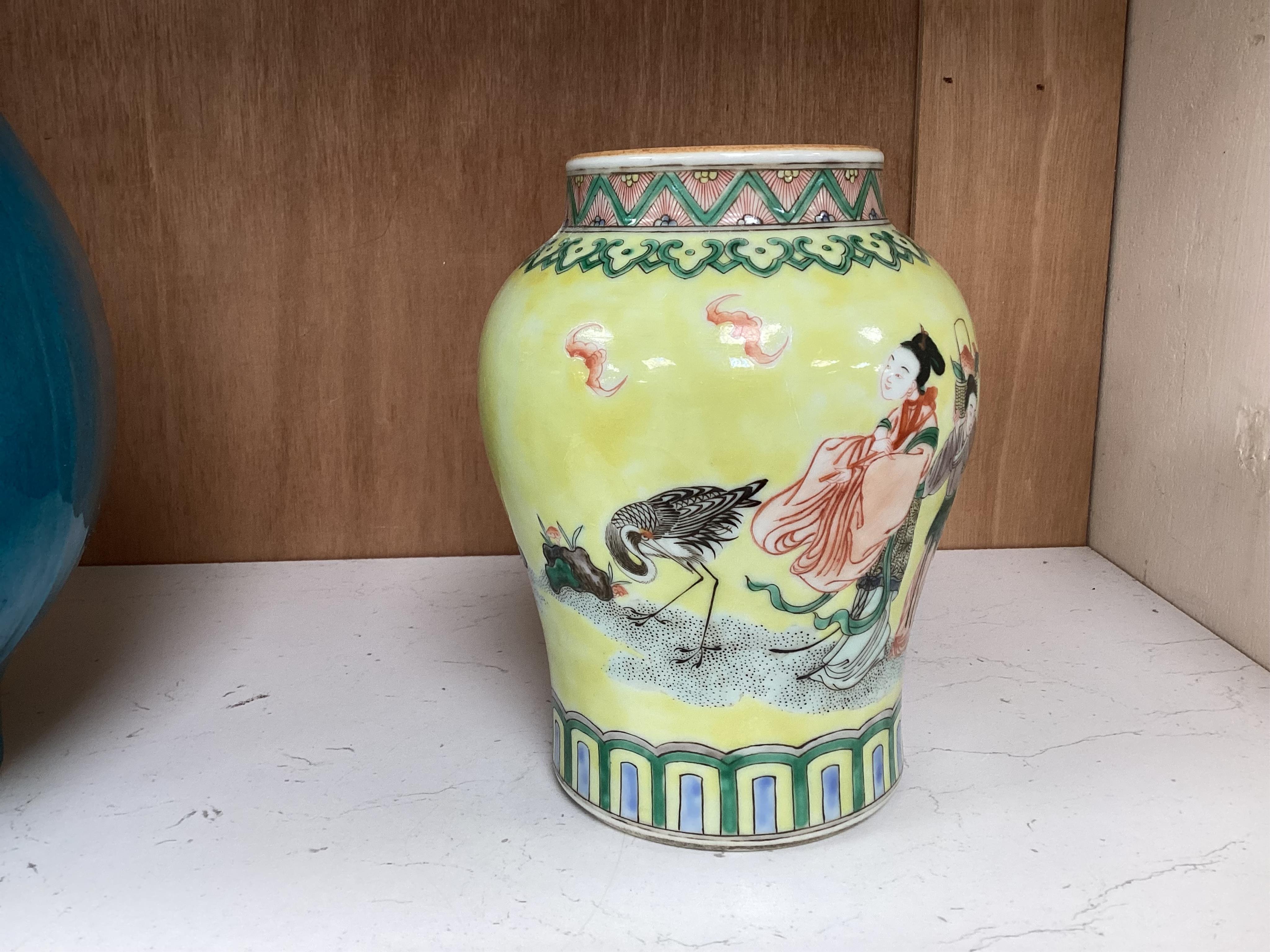 A Chinese yellow ground figurative vase, 15.5cm high. Condition - good